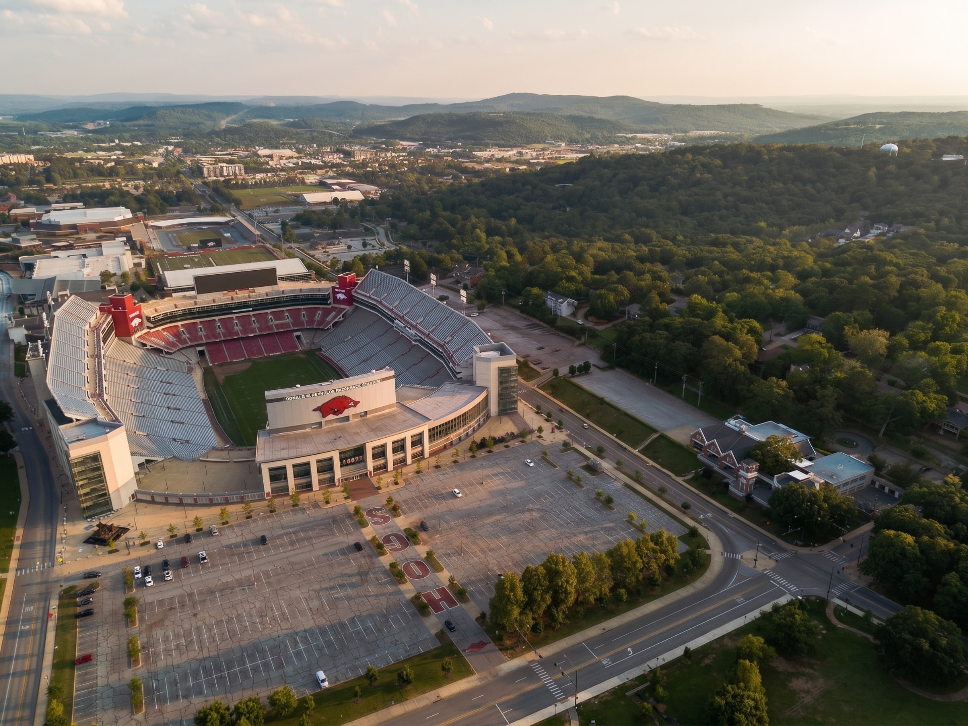 Aerial view of Donald W. Reynolds Razorback Stadium at sunset