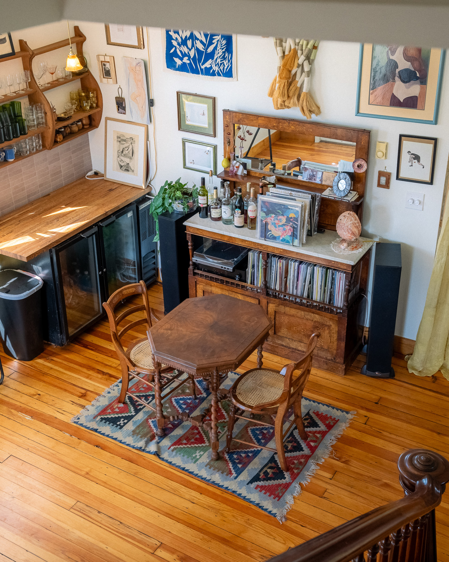 Home bar and record collection seen from the stairs