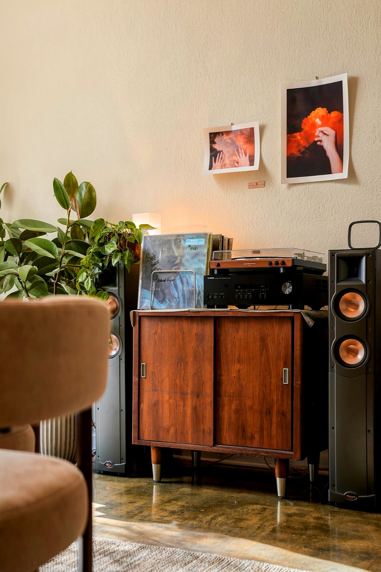 Record player and speakers on a walnut cabinet